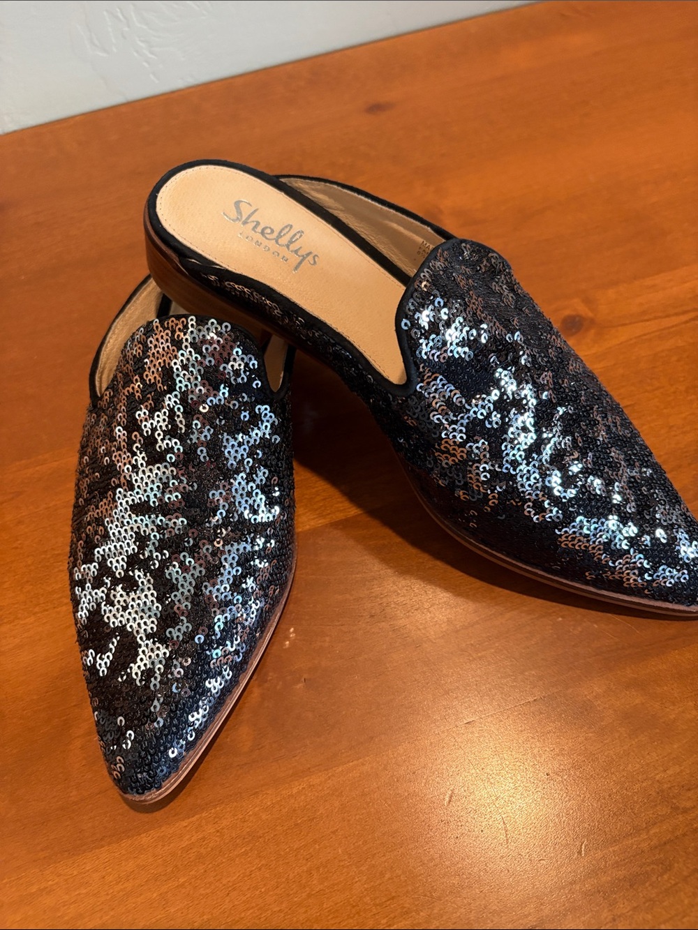 Shelly’s London black sequined mules. 8.5